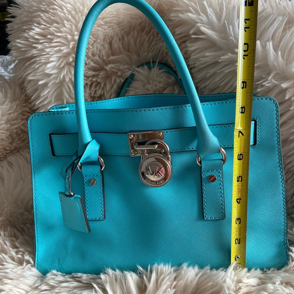 A beautiful turquoise with silver hardware Michael Kors purse. - Picture 2 of 7